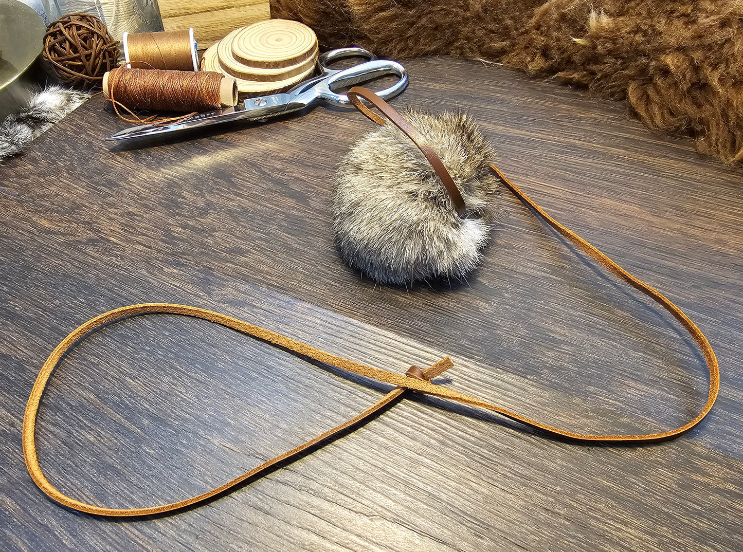 All natural, Rabbit fur Ball on a Durable Leather Cord. Catnip optional.