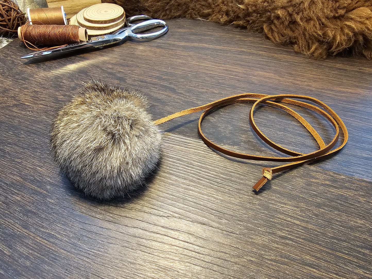 All natural, Rabbit fur Ball on a Durable Leather Cord. Catnip optional.