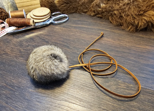 All natural, Rabbit fur Ball on a Durable Leather Cord. Catnip optional.