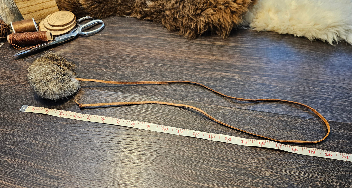 All natural, Rabbit fur Ball on a Durable Leather Cord. Catnip optional.